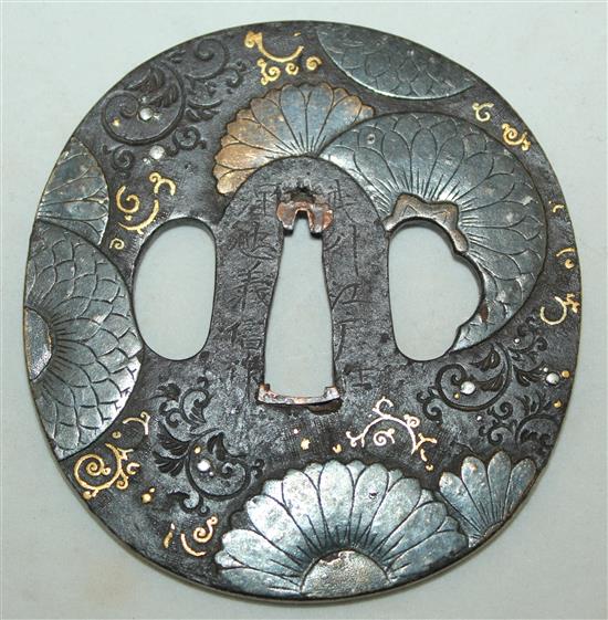 A Japanese iron and mixed metal tsuba, 19th century, 8cm